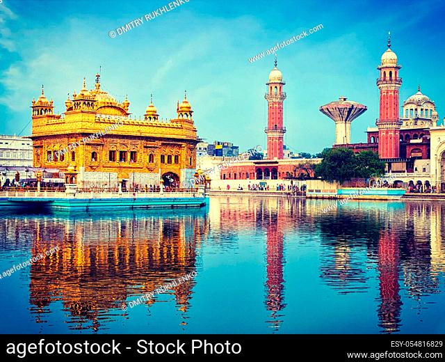 Vintage retro effect filtered hipster style image of famous indian toursit landmark and sacred pilgrimage site - Sikh gurdwara Golden Temple (Harmandir Sahib)