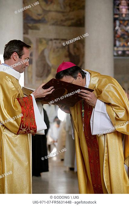 Bishop kissing the gospel in Sainte Genevieve's cathedral, Nanterre