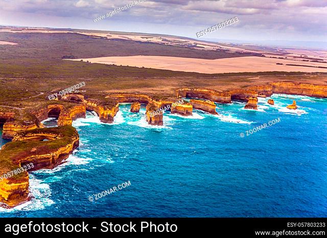 Scenic coastline. Picture taken from a helicopter. Port Campbell Park, Australia. Great Ocean Road and the Twelve Apostles is a group of limestone cliffs
