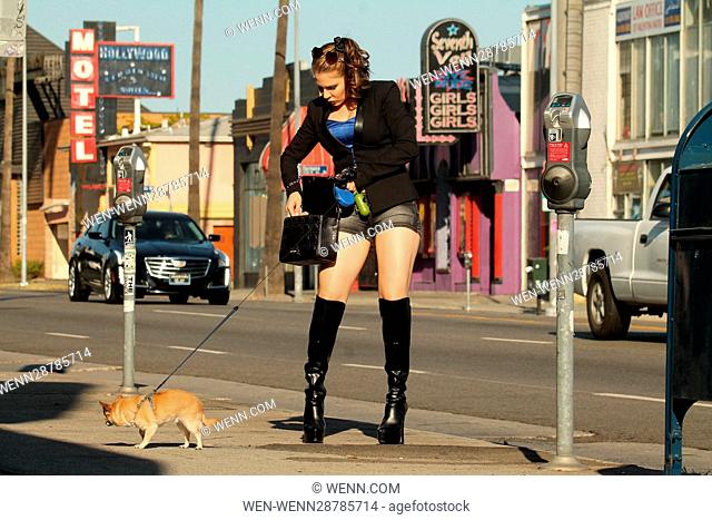 Erika Jordan walking her dog on Sunset Boulevard in Los Angeles, California, where she fixed her make-up using a roll of toilet paper in her purse