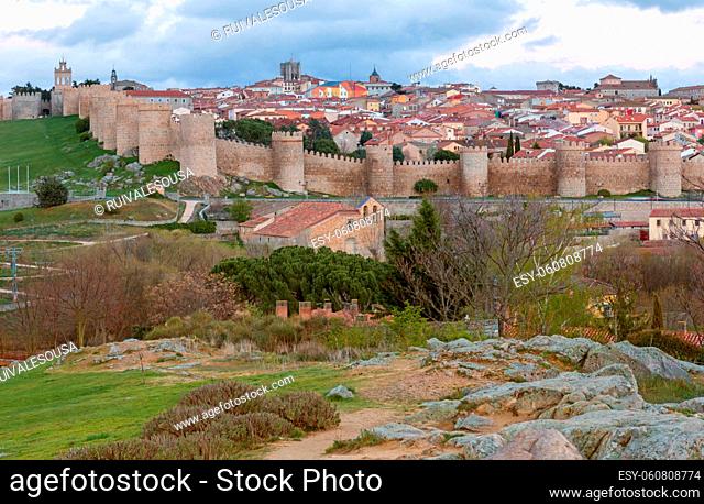 Panoramic view of the historic city of Avila from the Mirador of Cuatro Postes, Spain, with its famous medieval town walls. UNESCO World Heritage