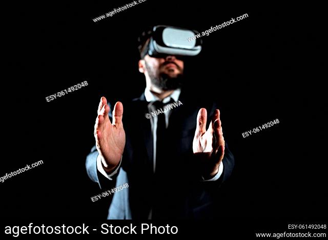 Businessman Wearing Suit Gesturing And Wearing Virtual Reality Simulator