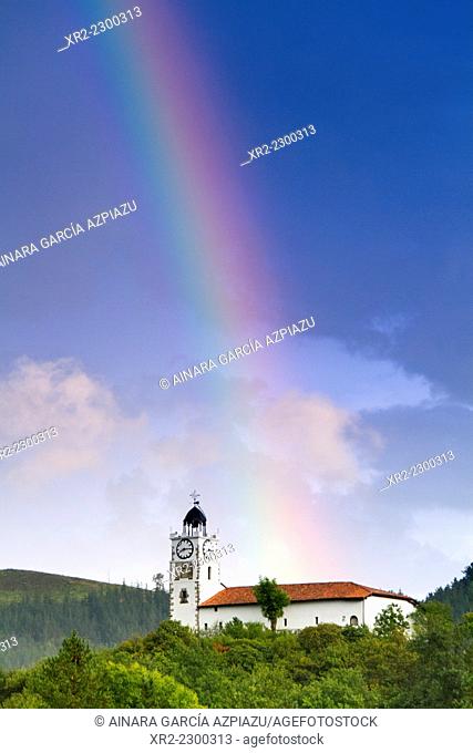 Rainbow over San Martin's clock, Azkoitia, Gipuzkoa, Basque Country