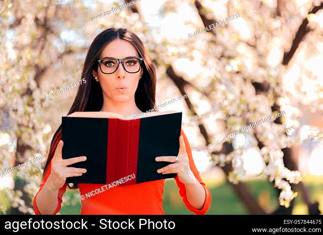 Girl wearing eyeglasses in springtime floral nature