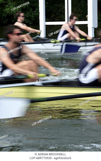 England, Oxfordshire, Henley-on-Thames, Boat crews rowing powerfully off the start line during a race at the annual Henley Royal Regatta