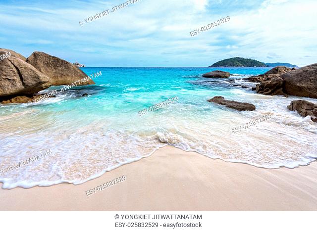 Beautiful nature of blue sea sand and white waves on small beach between rocks during summer at Koh Miang island in Mu Ko Similan National Park