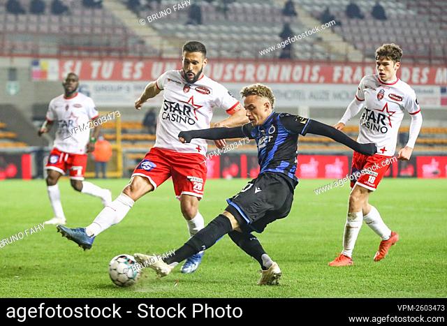 Mouscron's Matias Silvestre and Club's Noa Lang fight for the ball during the Jupiler Pro League match between Royal Excel Mouscron and Club Brugge KV