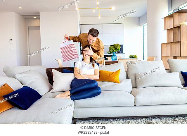 Couple relaxing in modern apartment