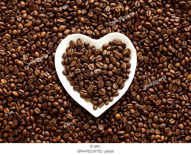 Coffee beans in heart shape bowl