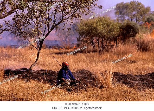 Balgo woman hunting water-holding frogs, (not model released) Balwina Aboriginal Land, southeast Kimberley region, Western Australia, Australia
