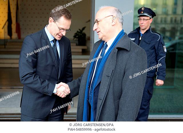 Berlin's mayor Michael Mueller (L, SPD) pays condolence to French Ambassador Philippe Etienne at the French Embassy in Berlin,  Germany, 08 January 2015