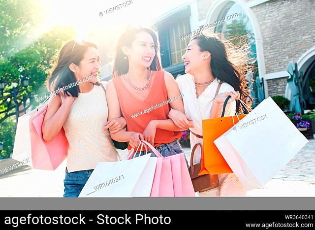 Young girls happy shopping