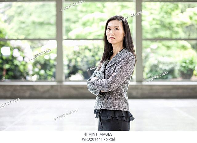 Portrait of an Asian businesswoman in the lobby of a convention centre