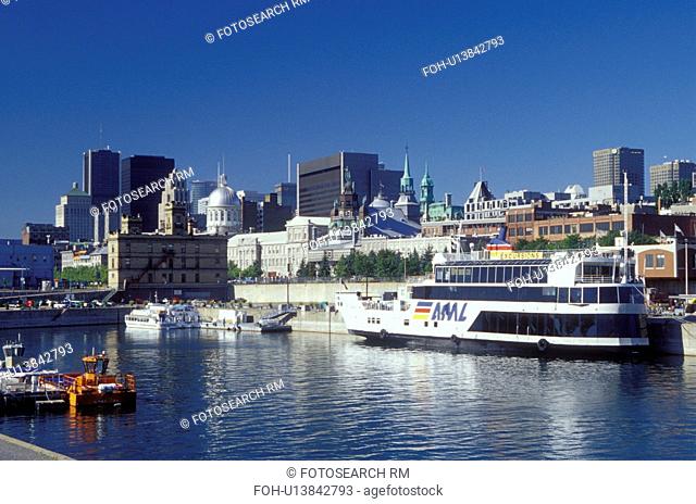 Montreal, Canada, Quebec, Vieux Port along the St. Lawrence River (Fleuve Saint-Laurent). Skyline of downtown Montreal
