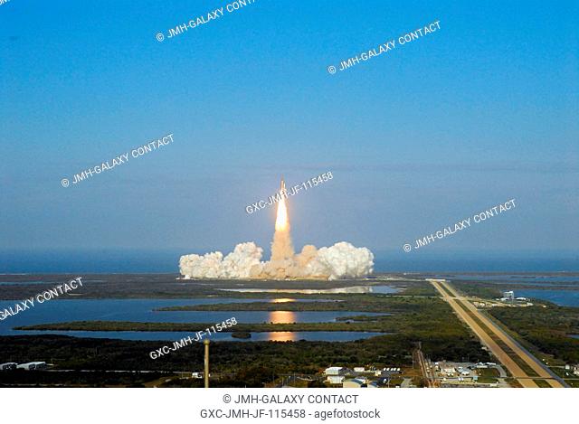 Space shuttle Discovery and its six-member STS-133 crew head toward Earth orbit and rendezvous with the International Space Station