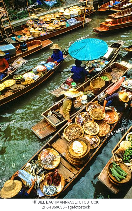 Color graphic image of shopping boats at the famous Floating Market at Damnernsaduak near Bangkok Thailand