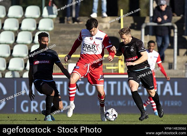 Lommel's Vinicius Dos Santos Caue, Mouscron's Marko Babic and Lommel's Robin Henkens pictured in action during a soccer match between Lommel SK and Royal Excel...