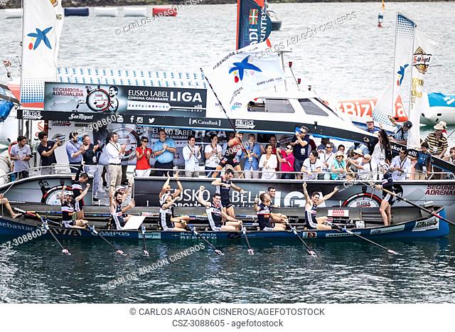 CASTRO URDIALES, SPAIN - JULY 15, 2018: Competition of boats, regata of trainera, Urdaibai Avia boat with the prize after winning the competition VI Bandera...