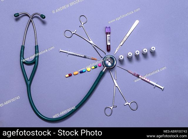 Stethoscope surrounded by an assortment of medical equipment and treatments