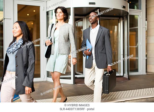 Business people walking on steps