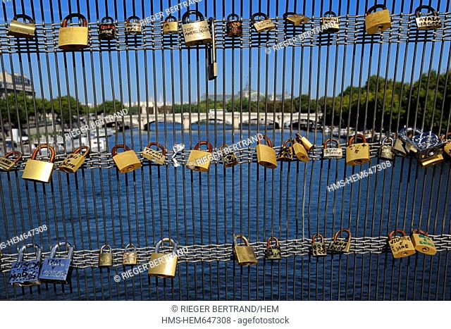 France, Paris, the passerelle bridge Leopold Sedar Senghor, formerly known as passerelle Solferino, lovers declare their love by hanging an engraved padlock