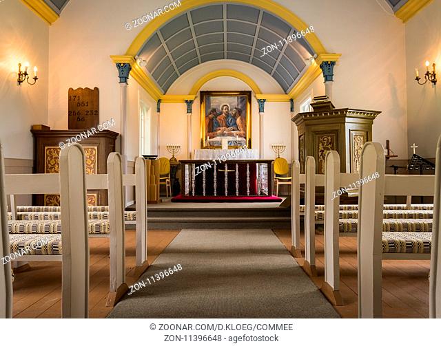 Hrepphola, Iceland - June 26, 2016: Interior of Hreppholakirkja, wooden church with white benches and blue ceiling in Iceland