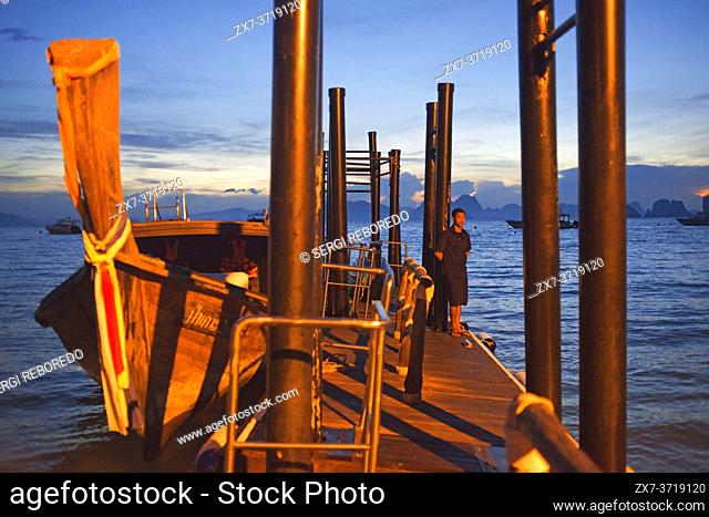 Six Senses Resort, Koh Yao Noi, Phang Nga Bay, Thailand, Asia. Boat in the harbour waiting for Sunrise Picnic breakfast on a deserted Island in Koh Hong...