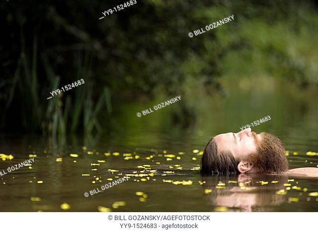 Head of Bearded Man floating in lake - Cedar Mountain, North Carolina USA