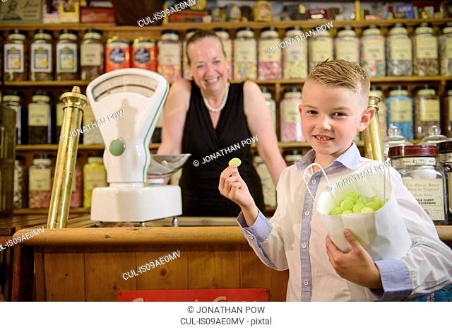 Boy holding bag of confectionery