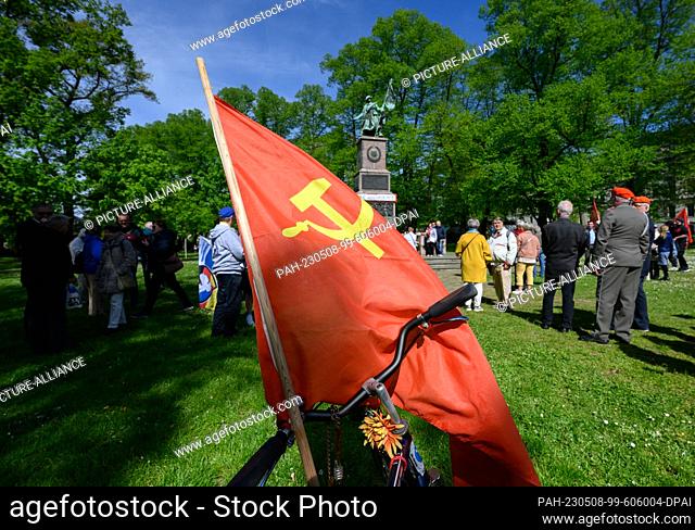08 May 2023, Saxony, Dresden: The flag of the former Soviet Union flies in the wind at a commemorative event on Liberation Day at the Red Army Memorial