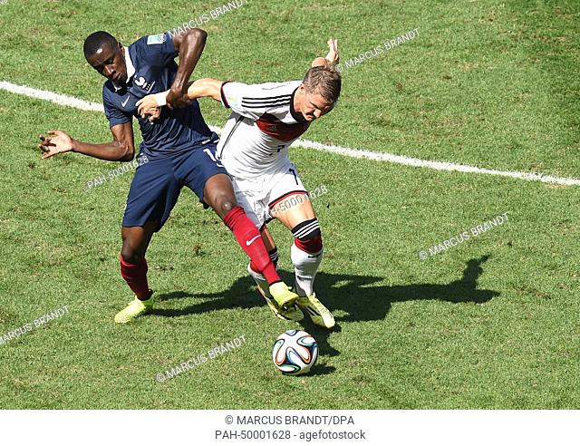 Blaise Matuidi (L) of France and Bastian Schweinsteiger of Germany vie for the ball during the FIFA World Cup 2014 quarter final soccer match between France and...