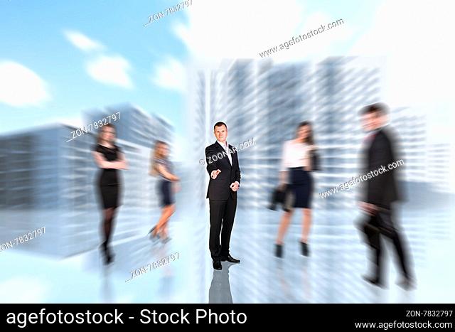 People blurred in the city center on the street with focused business man