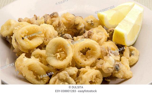 Fried calamari rings served on a plate