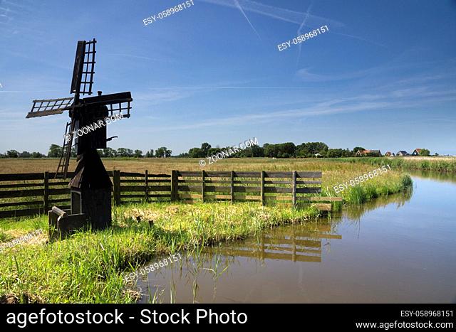 Small windmill Weidemolen Grootschermer near the village Grootschermer which is part of the Dutch historical town Alkmaar