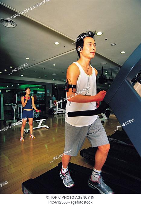 People Exercising At Health Club, Korean