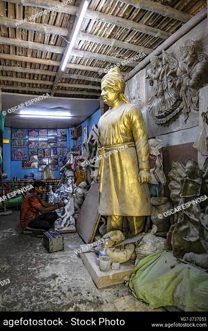 Kolkata, India - September 2020: A craftsman making clay and straw sculptures for the Durga Puja festival in Kumartuli, the potters' district of northern...