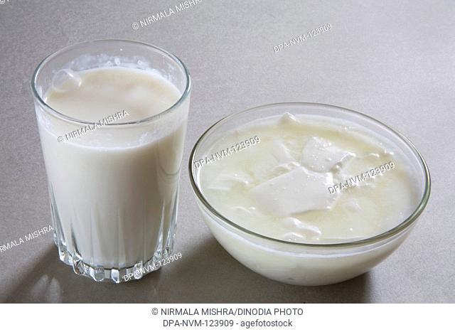 Full glass of milk and curd yogurt dahi made from milk home or dairy product , India