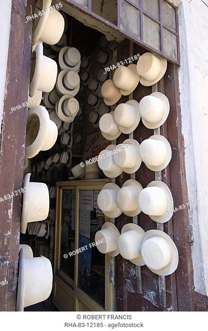 Shop of Alberto Pulla, the famous hatter on Calle Larga, where paja toquilla, misnamed panama hats, are sold and repaired with white sulphur paint, Cuenca