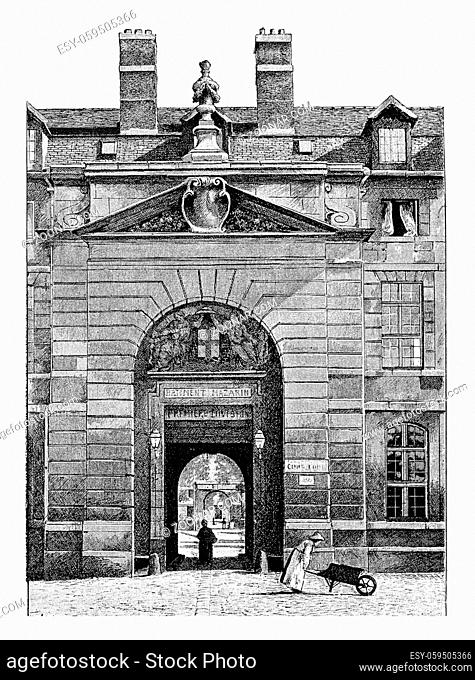 Entrance to the courtyard of the Mazarine Library at the Palace of the Institute of France in Paris, France. Vintage engraving