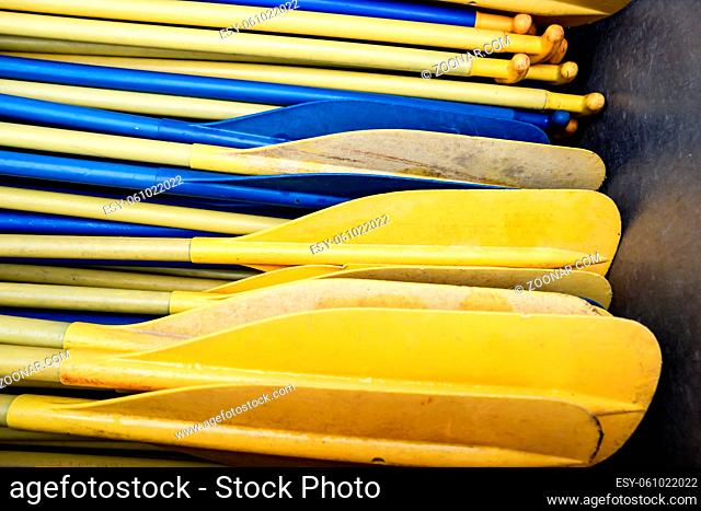 Yellow and Blue Boat Paddles in Detail