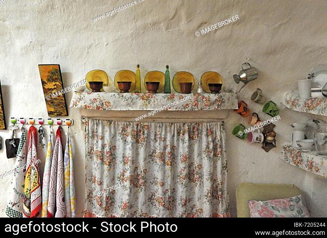 Curtain with decoration of objects from kitchen of cave house, Calguerin, Cuevas del Almanzora, Andalusia, Spain, Europe