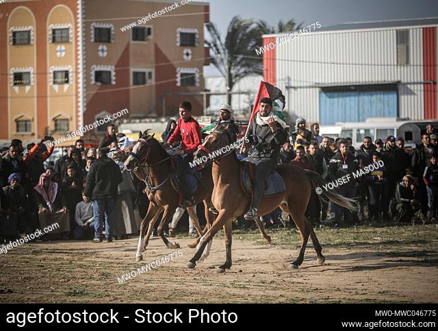 Palestinian Bedouins on horses and camels as they participate in a traditional race to commemorate Earth Day, Gaza City. Palestine