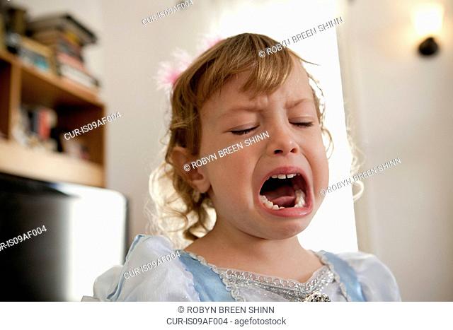 Close up of female toddler crying