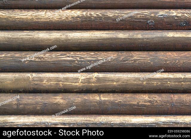 Natural brown log cabin wood wall. Wall texture background pattern. Wood planks, boards are old with a beautiful rustic look, style