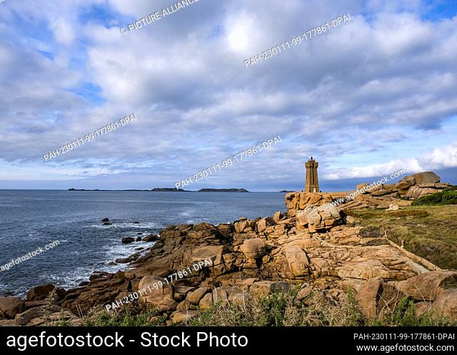 PRODUCTION - 03 October 2022, France, Ploumanach: The Phare de Ploumanach lighthouse on the Cote de Granit Rose coastline