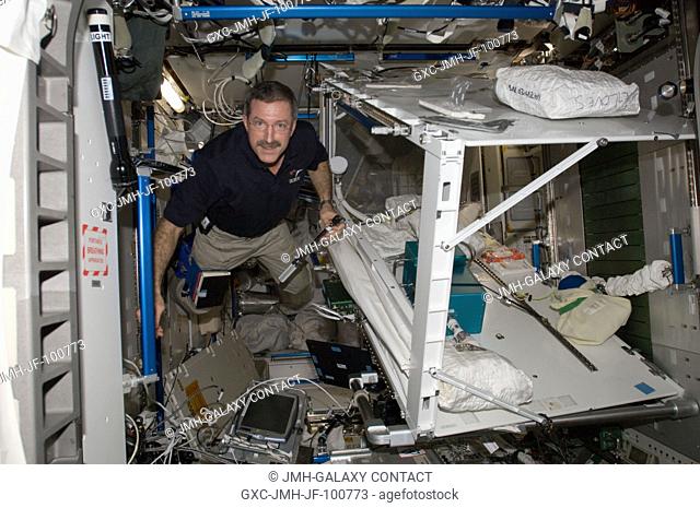 NASA astronaut Dan Burbank, Expedition 30 commander, removes, for replacement purposes, both Multifiltration Orbital Replacement Units (ORUs) from the Water...