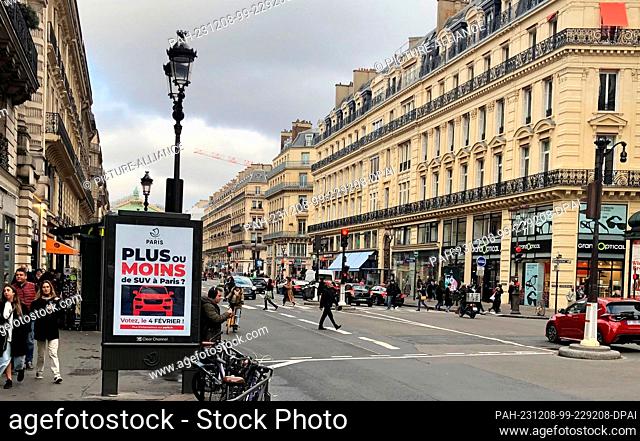 08 December 2023, France, Paris: On a billboard, the city of Paris informs about a citizen survey on increased parking fees for SUVs