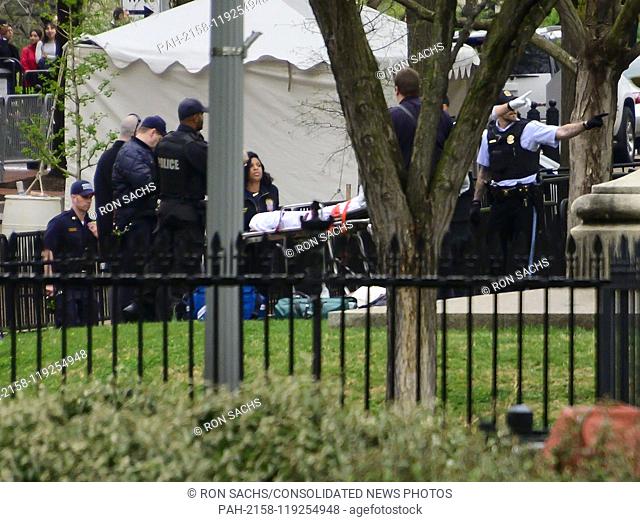 An unidentified person is attended to by United States Secret Service and US Park Police during an incident in Lafayette Park