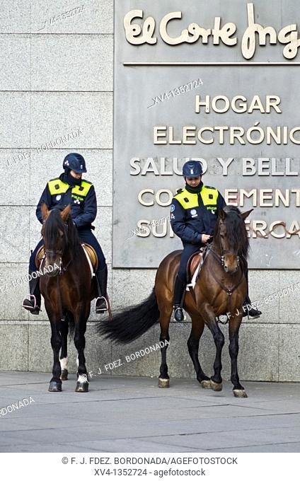 Policeman couple at Callao Square in Madrid. Spain