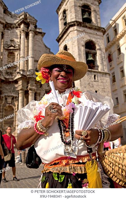 smiling cuban woman in traditional dress selling peanuts, Havana, Cuba, Caribbean